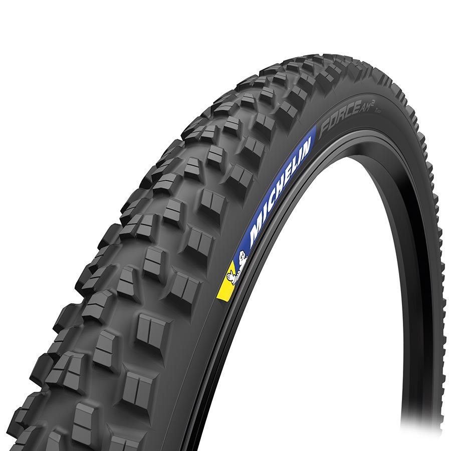 Michelin black mountain bike tire with aggressive tread blocks and sidewall logo