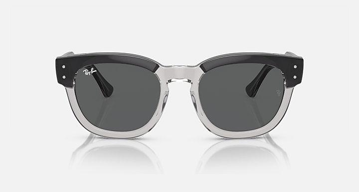 Sunglasses with dark round lenses, transparent dark-gray frame and silver center bridge
