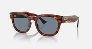 Tortoise-pattern rounded sunglasses with dark grey lenses and wide frame