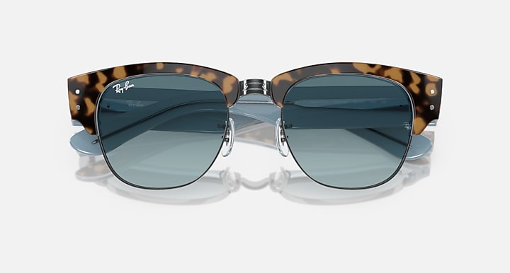Tortoise sunglasses with blue lenses and double-bridge metal center
