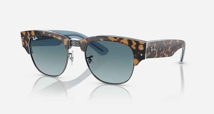 Tortoise-and-gold sunglasses with blue-green lenses and metal bridge detail