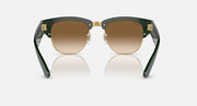 Green sunglasses with brown lenses and gold-toned metal details