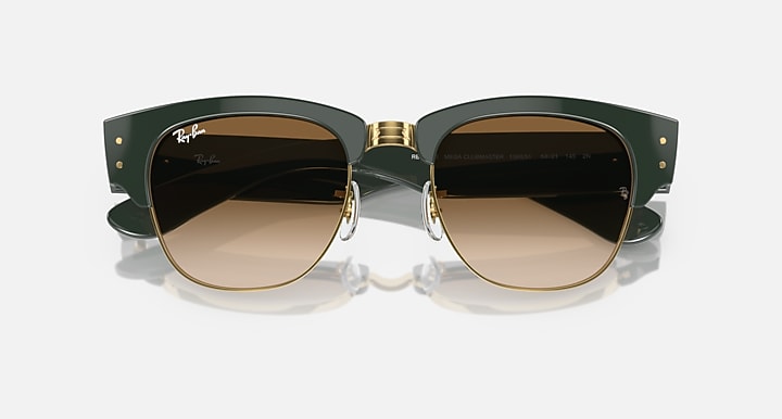 Green sunglasses with dark lenses and gold-toned round frames