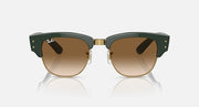Green sunglasses with brown lenses and gold-toned metal bridge