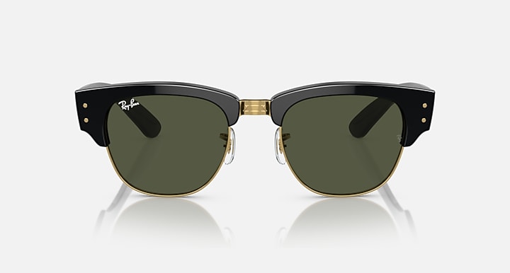 Clubmaster sunglasses front view with green lenses, black frame, and gold-tone bridge