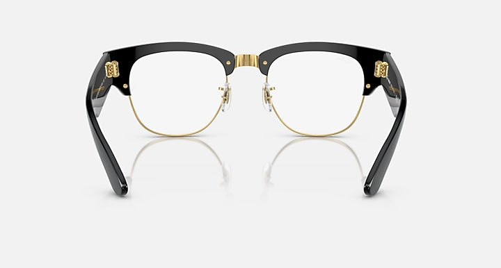 Clubmaster sunglasses front view with clear lenses, black frame, and gold-tone bridge