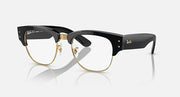 Clubmaster sunglasses with clear lenses, black frame, and gold-tone accents