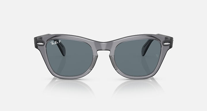 Sunglasses front view with dark lenses and transparent gray, square-shaped frame