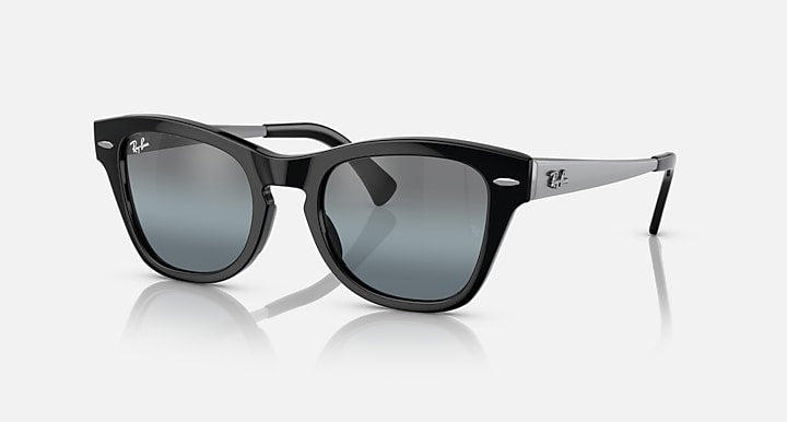 Black sunglasses with chunky square frames and blue-gray gradient lenses