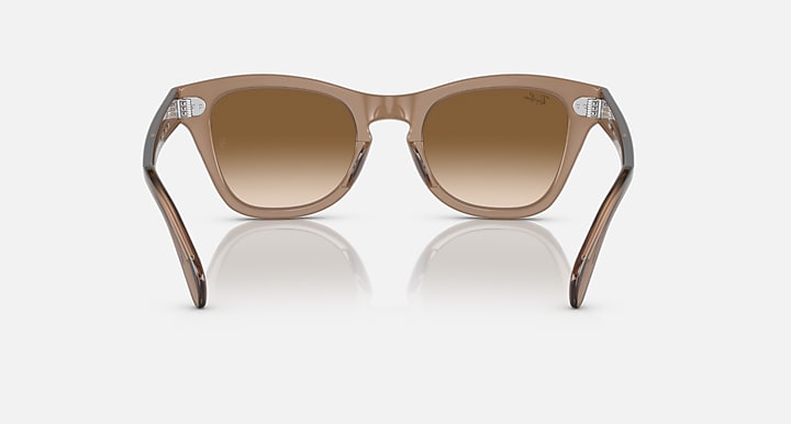 Light brown square sunglasses with brown lenses and flared temple arms
