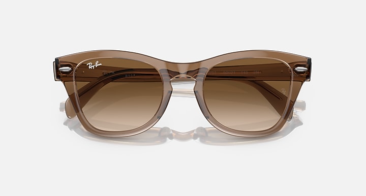 Light brown translucent sunglasses with brown lenses, shown straight-on from above