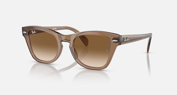 Light brown translucent square sunglasses with brown gradient lenses and dark temple tips
