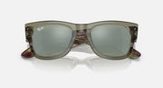 Square Wayfarer sunglasses with green tinted lenses and marbled brown/olive frame, angled view