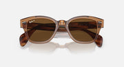 Ray-Ban polarized sunglasses with amber-brown lenses and translucent brown frame