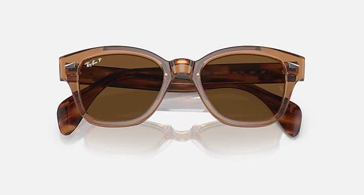 Ray-Ban polarized sunglasses with amber-brown lenses and translucent brown frame