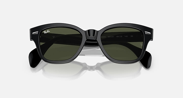 Ray-Ban RB0880S sunglasses, black full-rim frames with dark green lenses, angled front view.