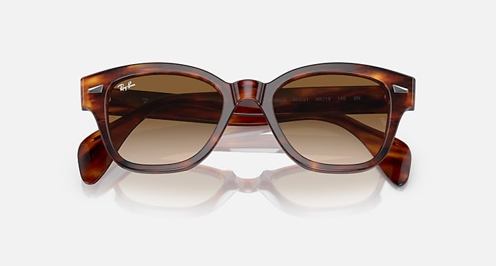 Ray-Ban RB0880S sunglasses with havana-style frames and brown lenses, angled front view.