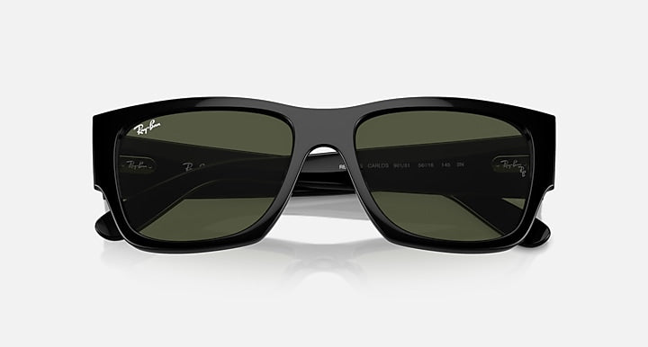Rectangular sunglasses with dark frame and green lenses, close front view