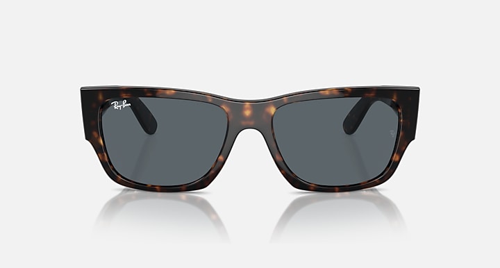Tortoise acetate sunglasses with dark lenses, centered front view and thick frame