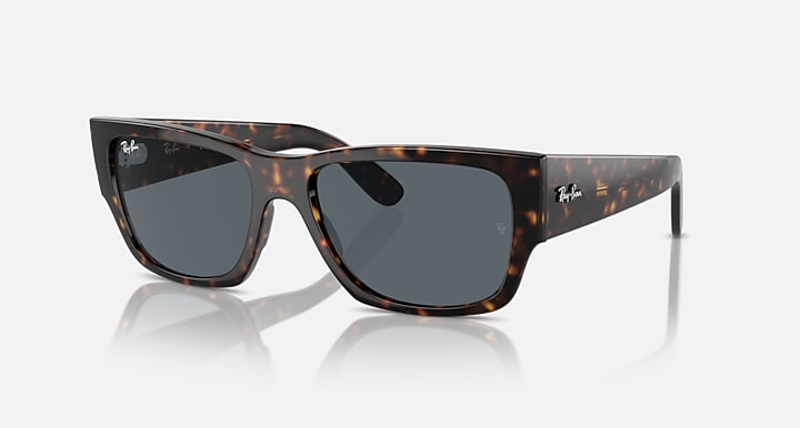 Tortoise acetate sunglasses with dark gradient lenses and front logo detail
