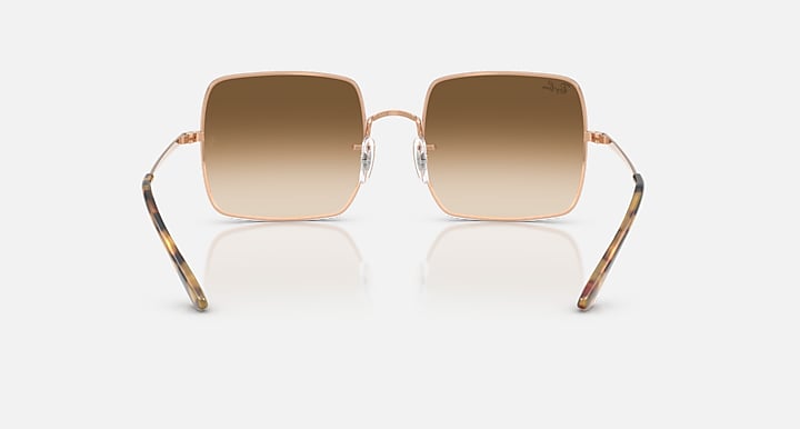 Ray-Ban RB1971 square sunglasses with gold frames and dark brown gradient lenses