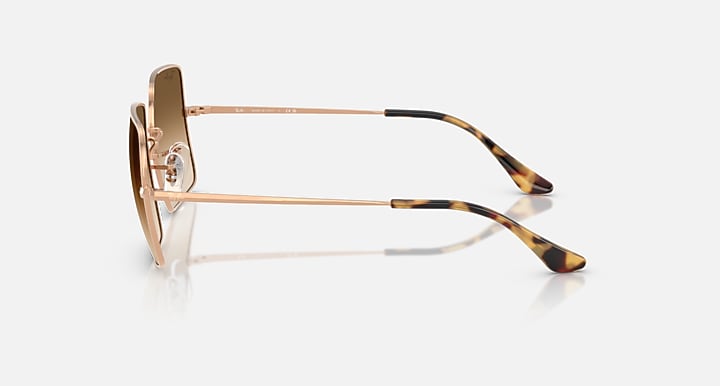 Ray-Ban RB1971 sunglasses side view with gold frame and dark brown gradient lens
