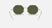 Ray-Ban octagonal sunglasses with dark green lenses and clear bridge in gold-tone frames
