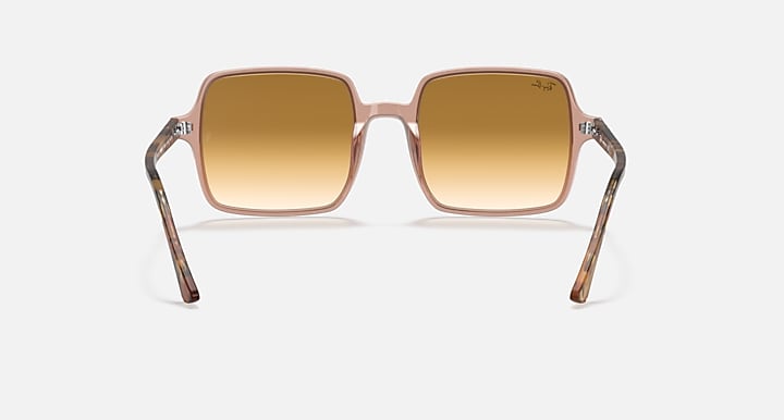 Ray-Ban square sunglasses with rose-pink frame and warm brown lenses