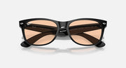 Wayfarer sunglasses with black frame and brown gradient lenses, arms visible