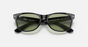 Black Wayfarer-style sunglasses with green lenses, branding and size text on temples.