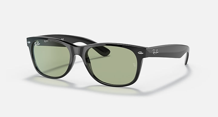 Black Wayfarer-style sunglasses with green lenses, full-rim frame and medium temples.