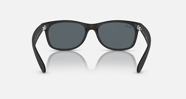 Ray-Ban Wayfarer sunglasses front view, black frames with dark gray lenses.