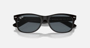 Ray-Ban Wayfarer sunglasses front view, black frames and dark lenses with bridge detail.