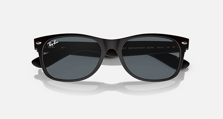 Ray-Ban Wayfarer sunglasses front view, black frames and dark lenses with bridge detail.