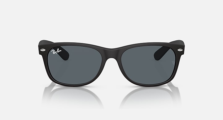 Ray-Ban Wayfarer sunglasses front view, dark gray lenses, black frames.