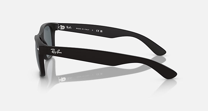 Ray-Ban Wayfarer sunglasses, side profile showing black frame and dark lenses.