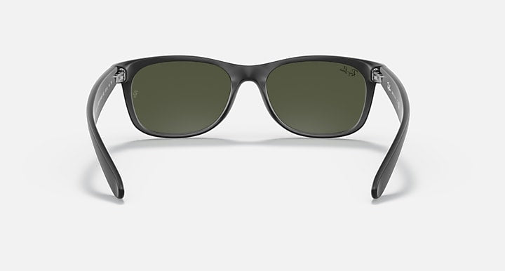 Ray-Ban Wayfarer sunglasses front view with dark frame and green lenses.