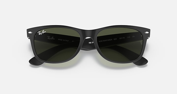 Ray-Ban Wayfarer sunglasses front view with dark green lenses and dark frame.
