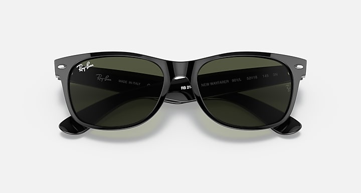 Ray-Ban Wayfarer sunglasses with dark green lenses and dark frame, close front.