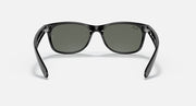 Ray-Ban Wayfarer sunglasses front view, black frame with dark green lenses.