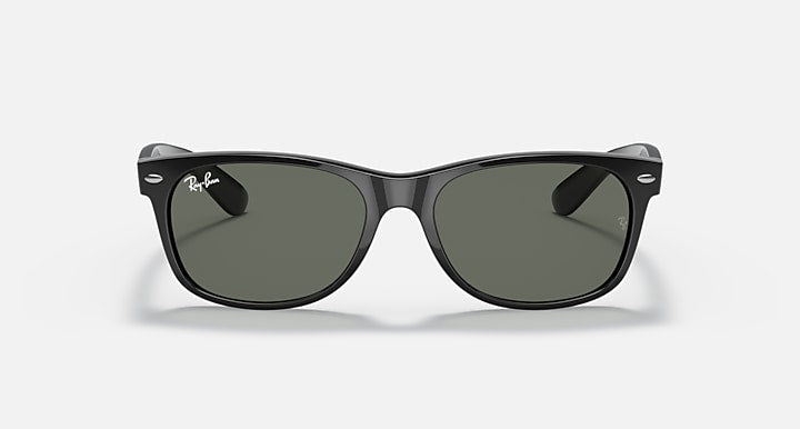 Ray-Ban Wayfarer sunglasses shown front view, black frame with dark green lenses.