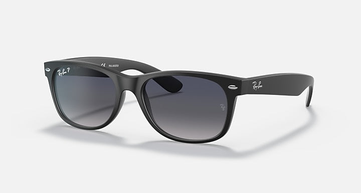 Ray-Ban sunglasses with matte black frame and dark gray lenses, rectangular Wayfarer shape
