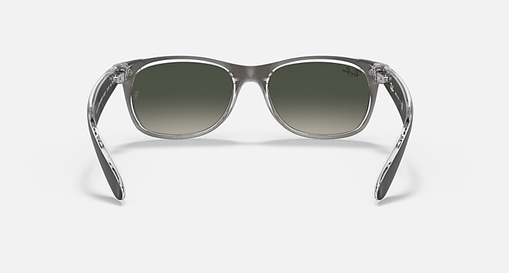 Ray-Ban New Wayfarer RB2132 sunglasses with transparent gray frame and green lenses