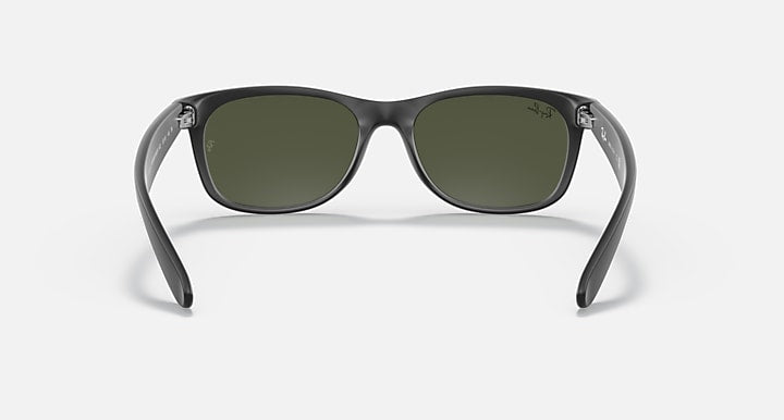 Matte black Wayfarer sunglasses with olive-green lenses, full-rim acetate frame