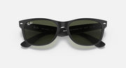 Black Wayfarer sunglasses with green-tinted lenses, glossy acetate full-rim frame