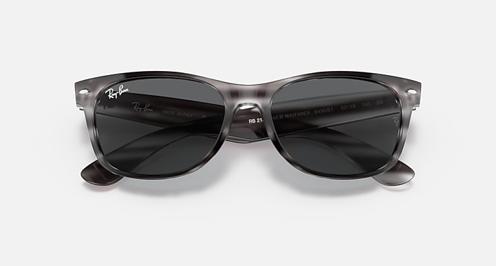 Ray-Ban New Wayfarer RB2132 sunglasses, dark frame with black lenses.