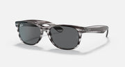 Ray-Ban New Wayfarer RB2132 sunglasses, translucent smoke frame with blue-gray lenses.