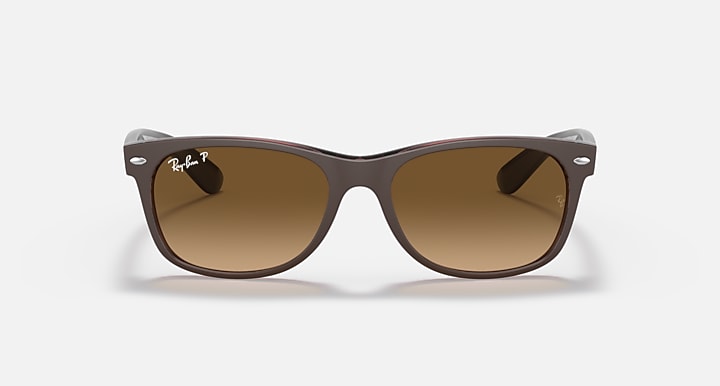 Ray-Ban New Wayfarer RB2132 dark frame sunglasses with warm brown lenses, angled view