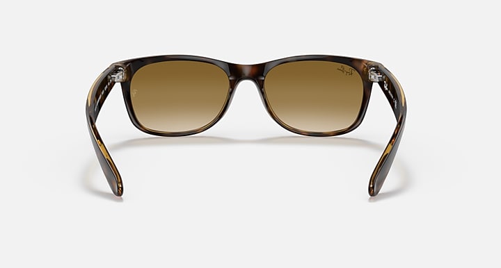 Ray-Ban New Wayfarer sunglasses with dark frame and tan-brown lenses, front view