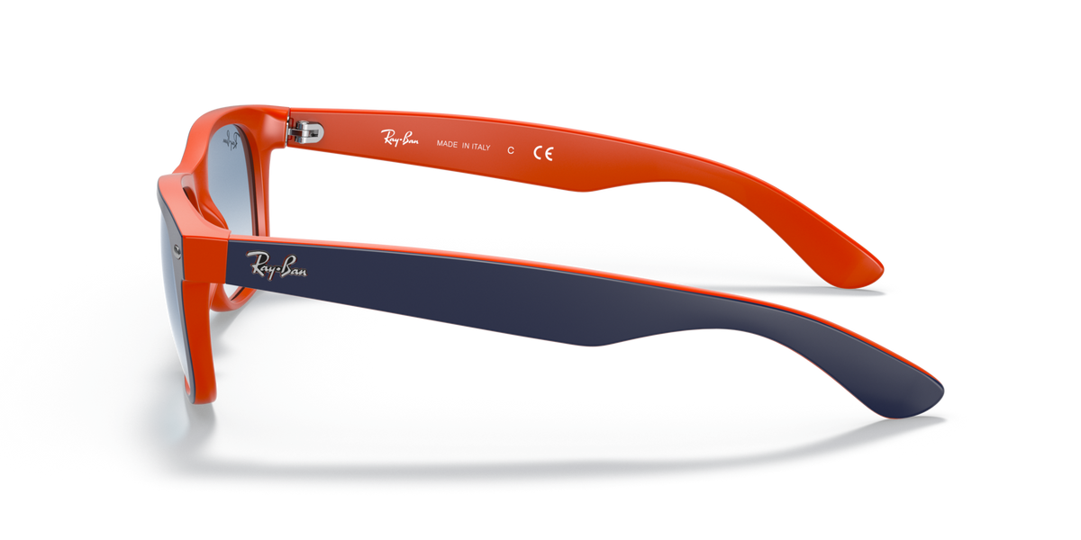 Orange wayfarer sunglasses shown from the side with blue-tinted lenses
